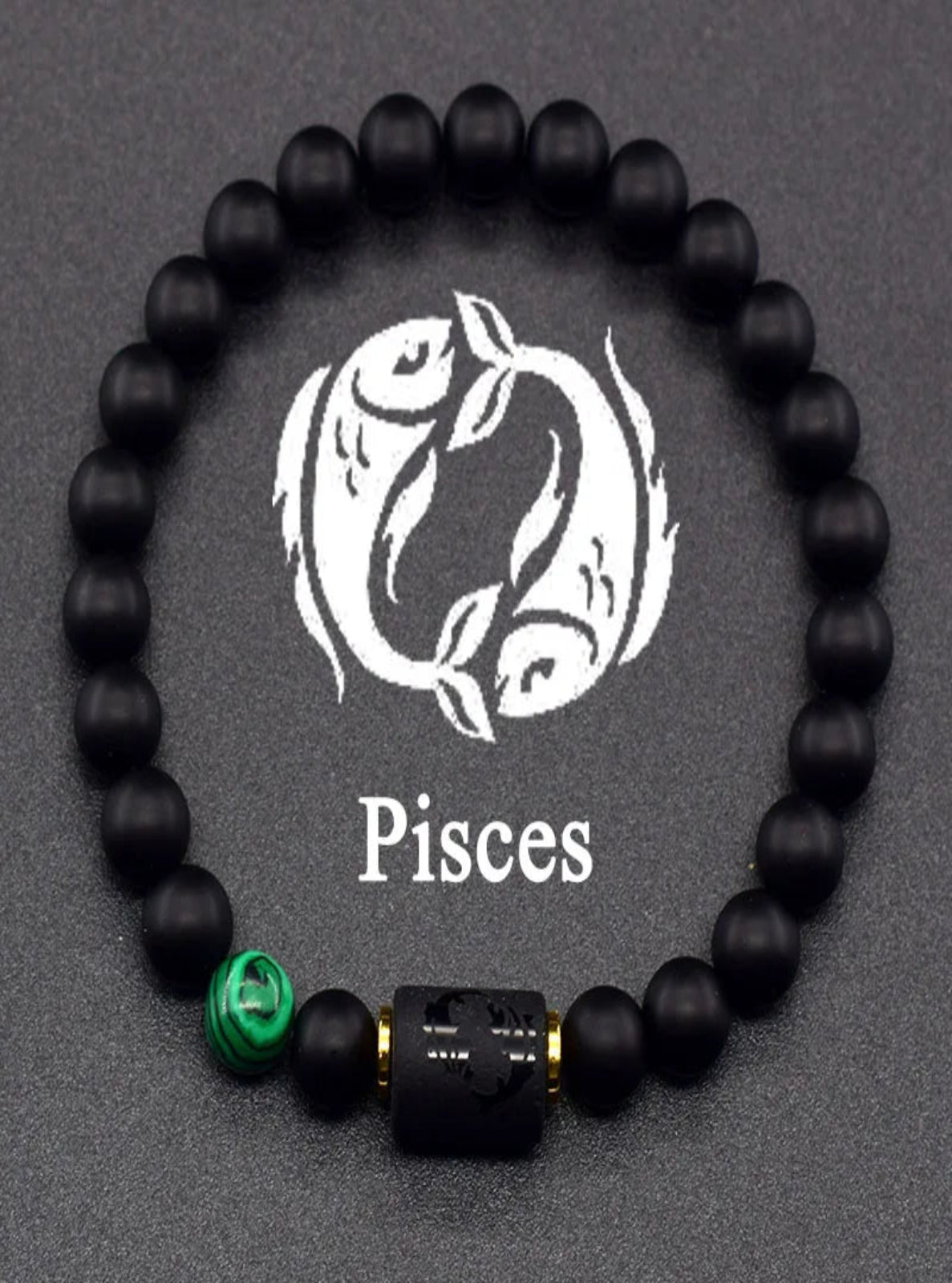 Black beaded bracelet with a green and gold accent bead on a gray background with 'Pisces' text.