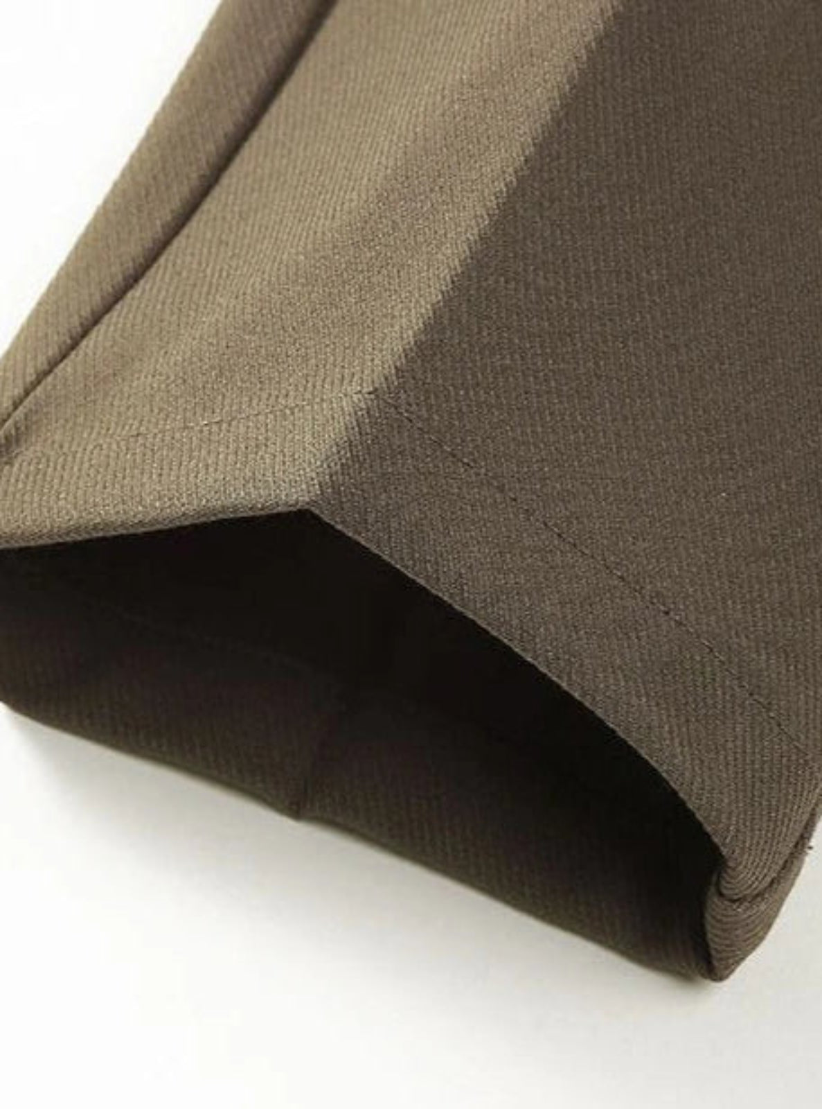 Close-up of brown fabric on a white background