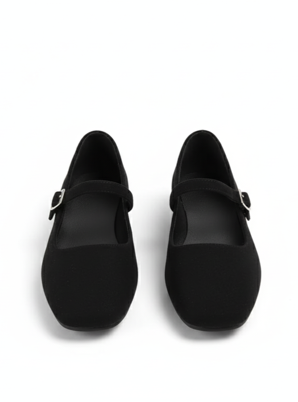 Pair of black shoes with buckles on a white background