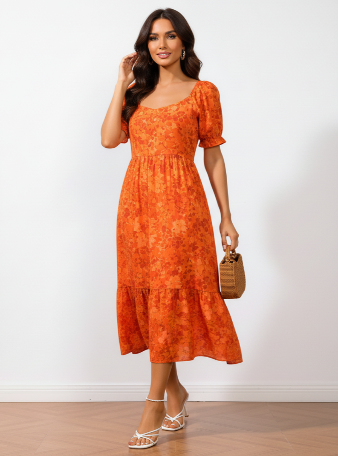 Woman wearing an orange dress holding a brown handbag against a white background
