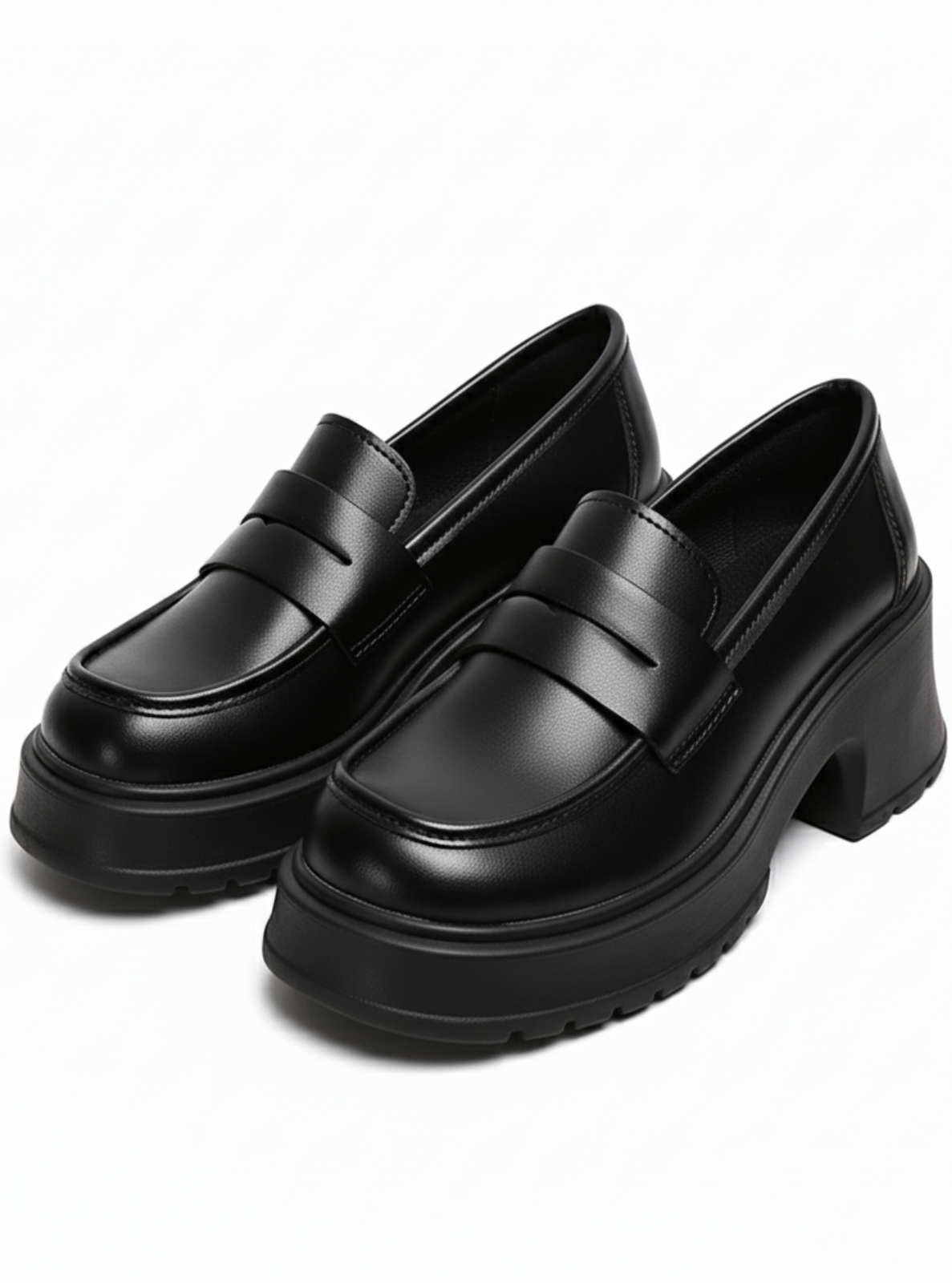 Pair of black loafers on a white background
