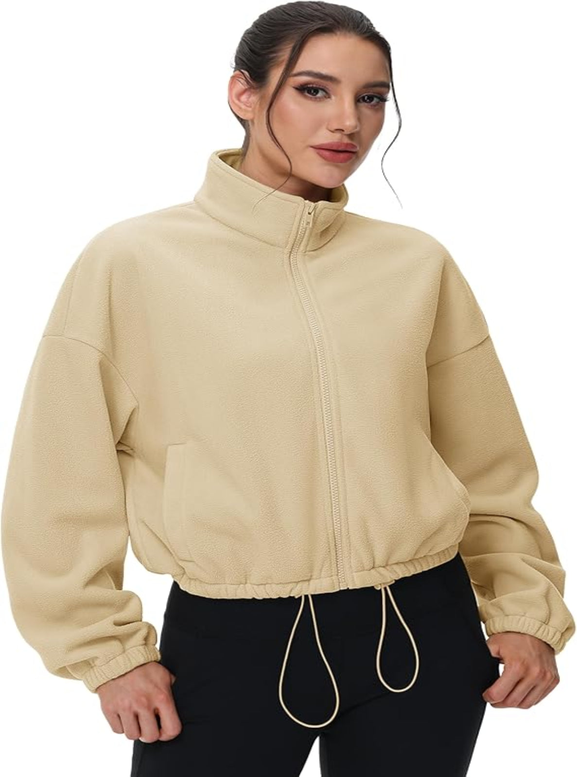 Woman wearing a beige jacket on a white background