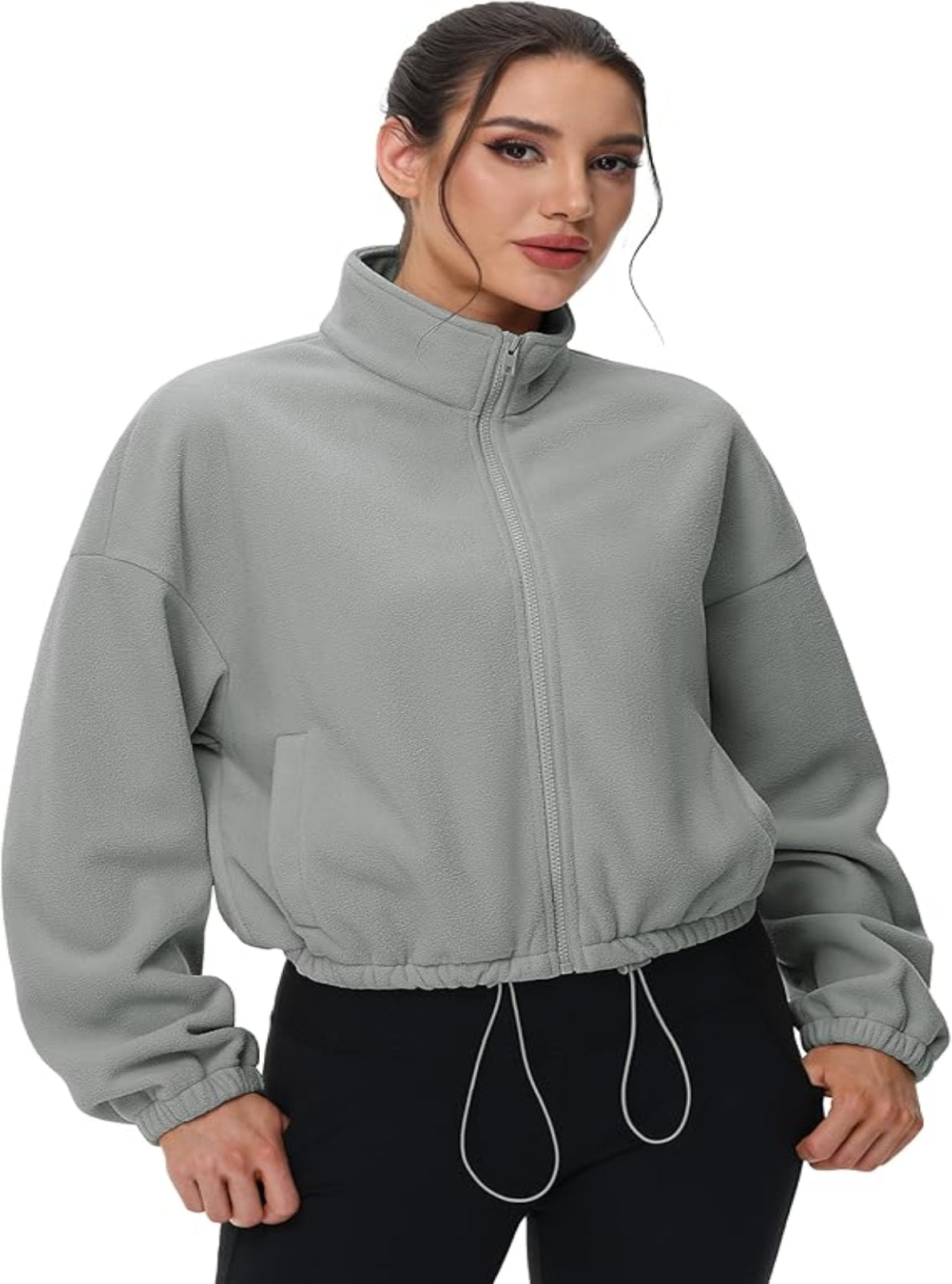 Woman wearing a gray jacket on a white background