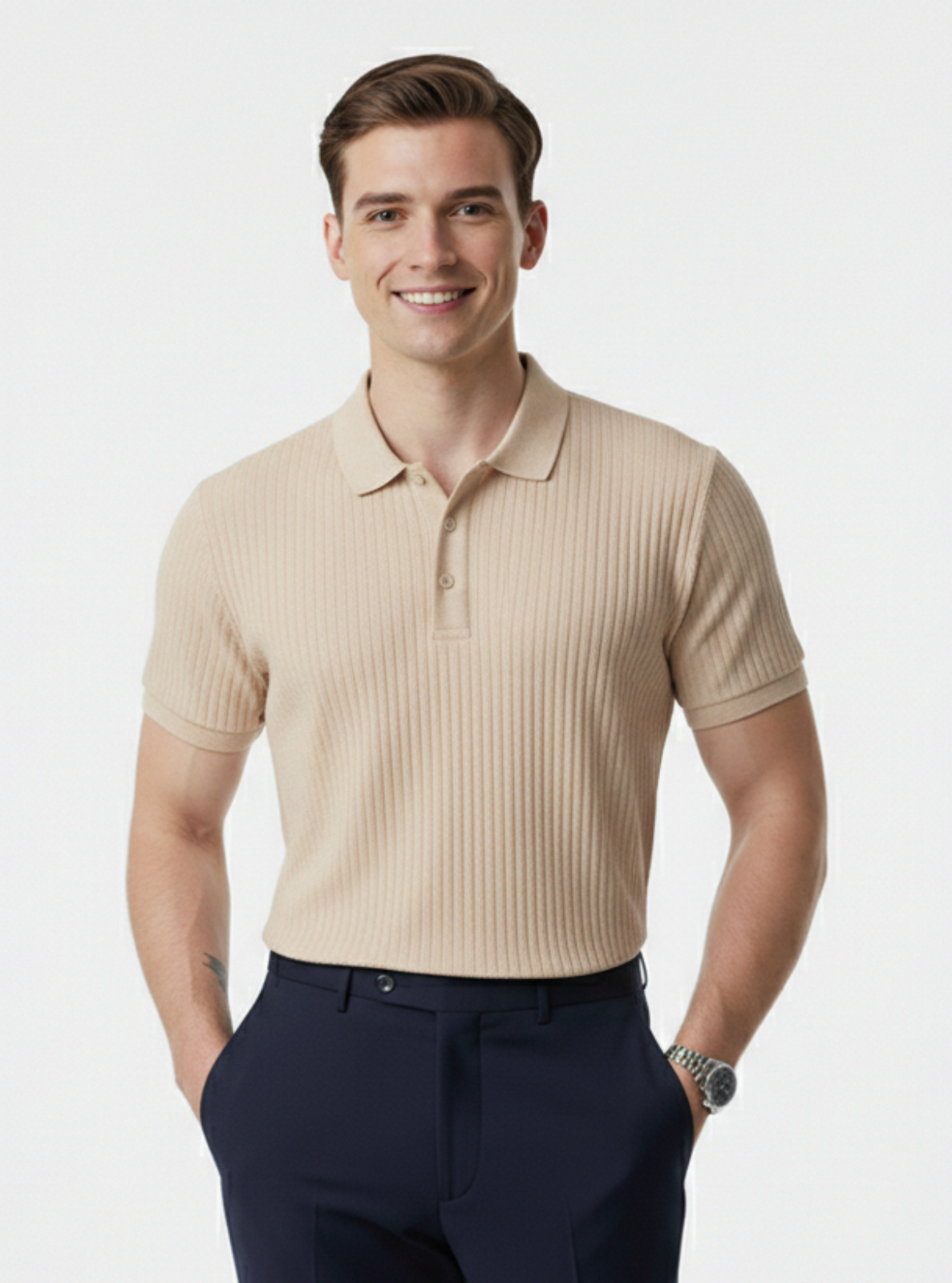 Man wearing a beige ribbed polo shirt and navy pants on a white background