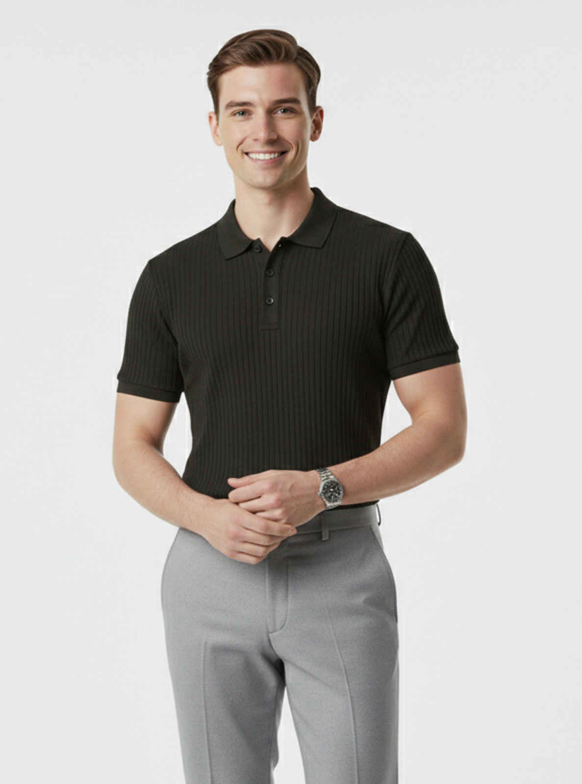 Man wearing a black polo shirt and gray pants on a white background