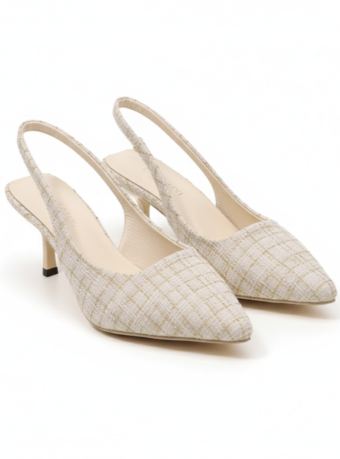 Pair of white pointed-toe slingback heels on a white background