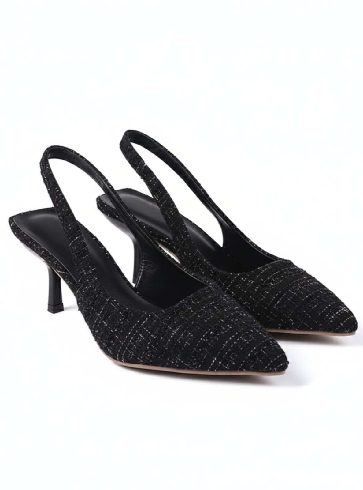 Black slingback shoes with a textured pattern on a white background