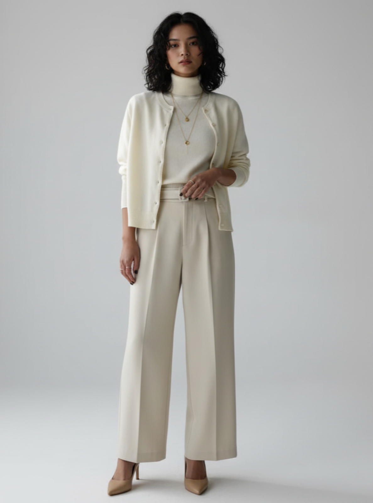 Woman wearing a beige suit with a white background