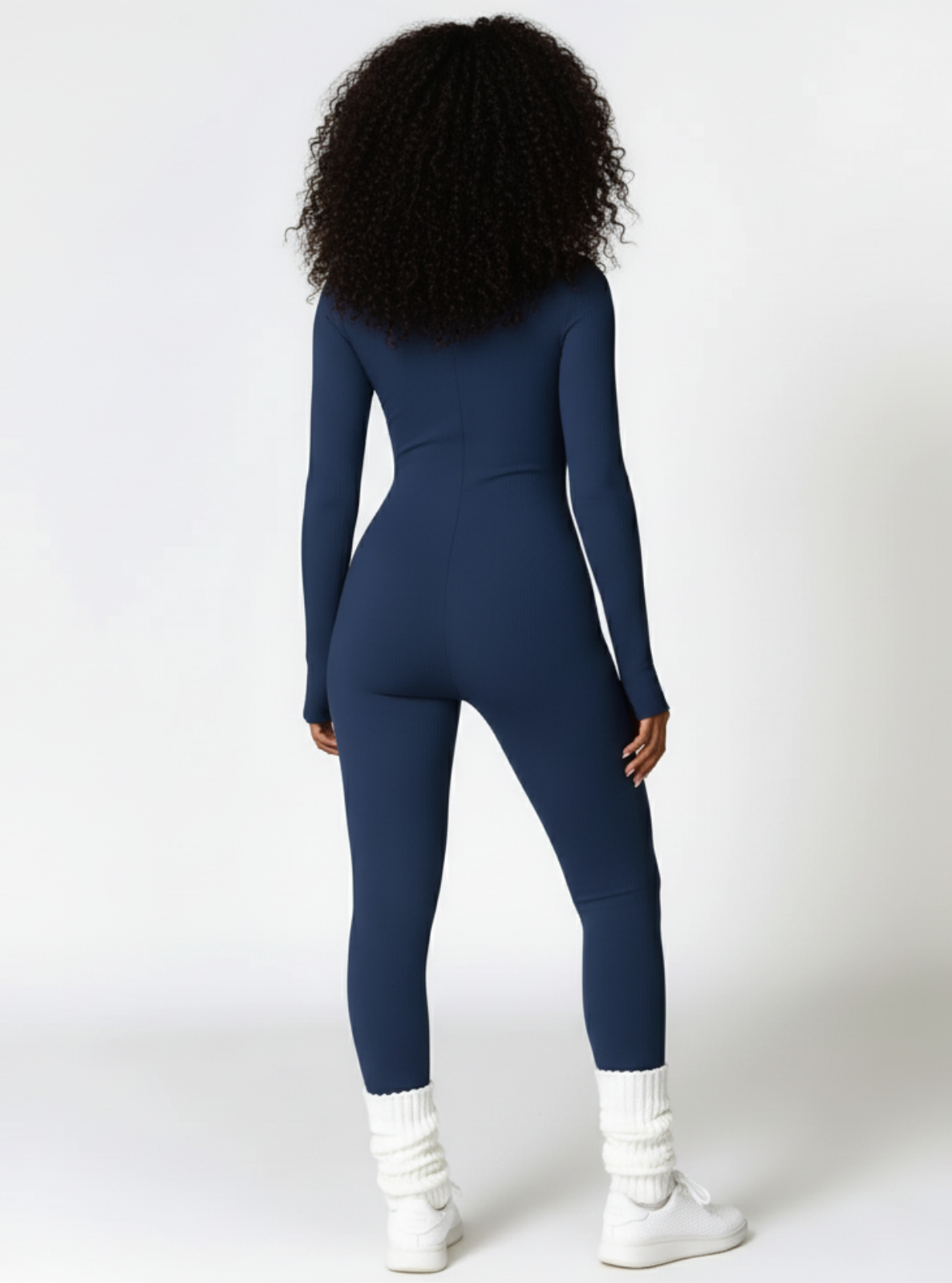 Person wearing a blue jumpsuit on a white background