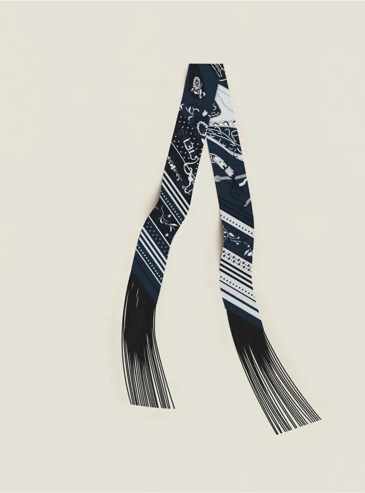 Black and white patterned scarf on a beige background