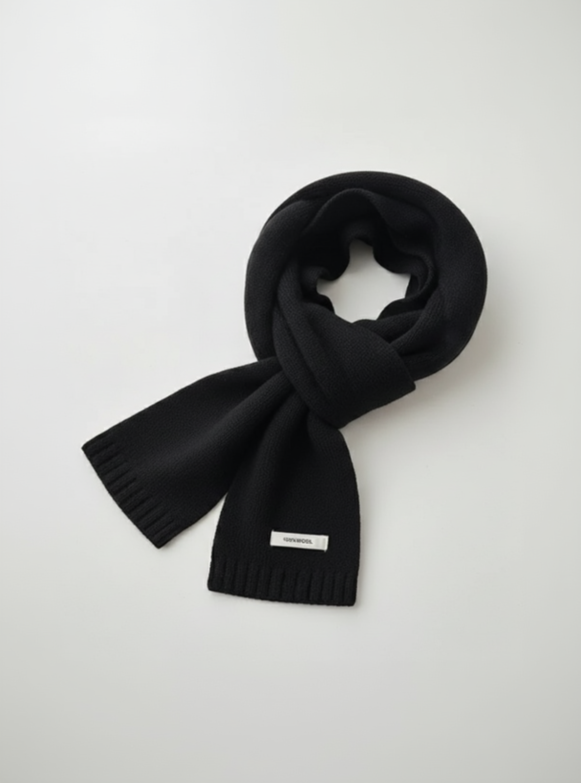 Black scarf with a brand label on a white background